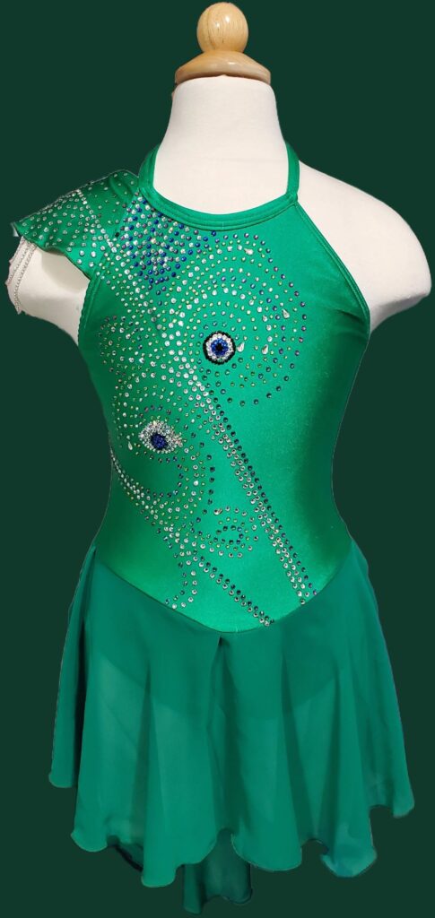 Green figure skating dress with rhinestone embellishments