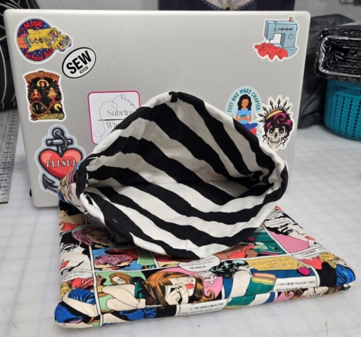 inside view of black and white striped padded computer sleeve