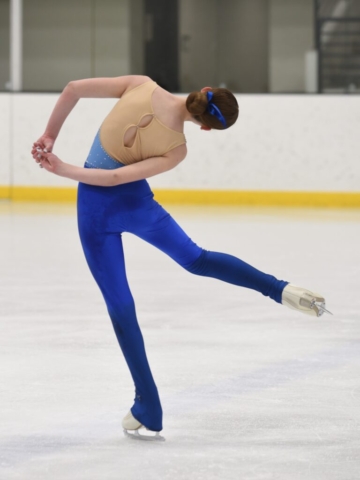 Blue figure skating unitard with rhinestone embellishments