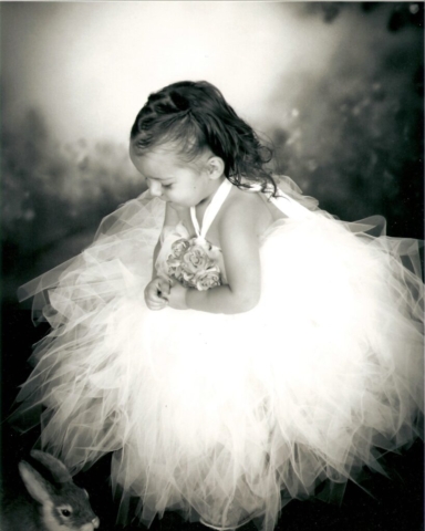 girl wearing a tutu flower girl dress