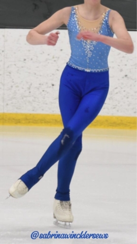 Blue figure skating unitard with rhinestone embellishments