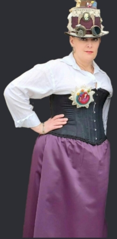 woman wearing a purple black and white steampunk costume.