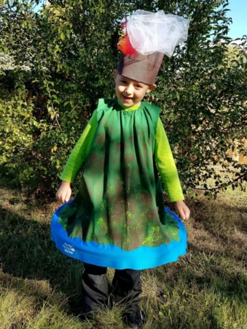 Boy wearing volcano costume with matching headdress.