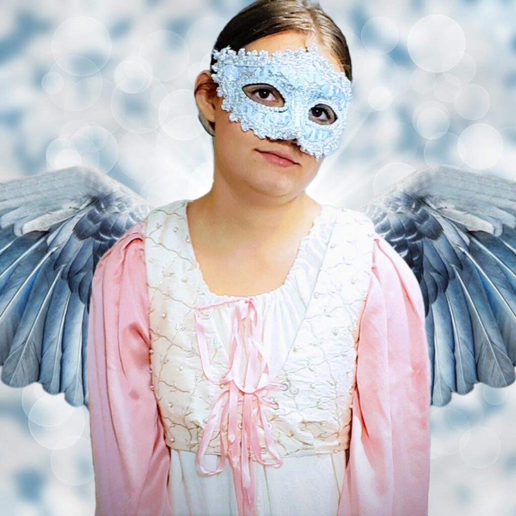 Girl wearing Renaissance dress costume with wings