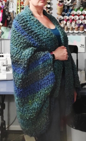 woman wearing Crocheted Sweater Shrug out of Green and Blue Variegated Yarn