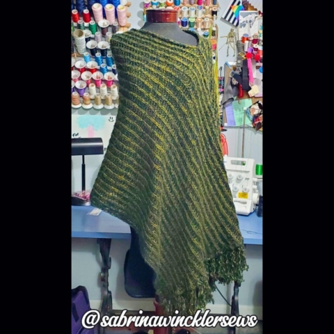 Two tone green sweater knit poncho with fringe