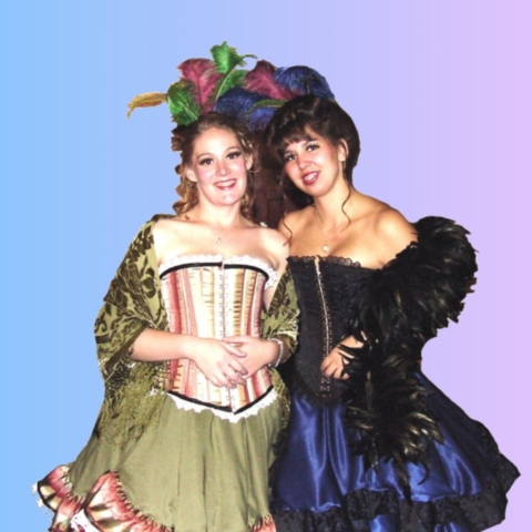 Two girls dressed as saloon girls or can can dancers